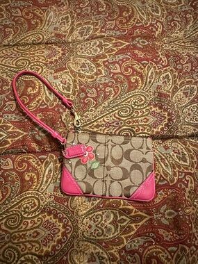 Coach Beige Signature Canvas Wristlet with Pink Trim and Flower Charm